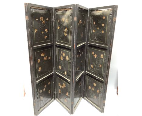 An Oriental changing screen with hand painted floral panels on one side and gilt painted bird scenes on the other, six panels