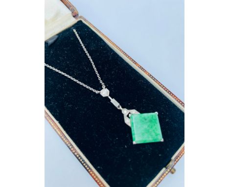 A white metal diamond and jade Art Deco necklace, in fitted box, inscribed Henry Simpson Ltd, Johannesburg. 