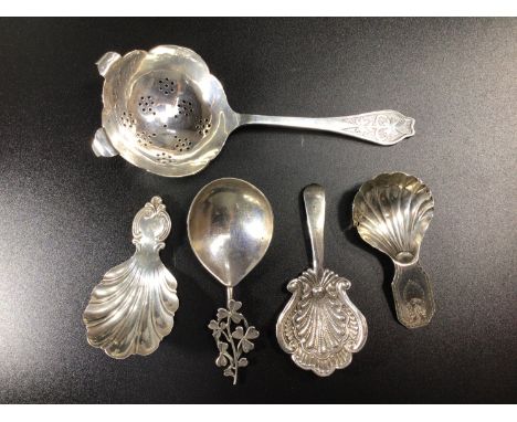 Four various silver caddy spoons including two examples by Maurice Freeman, one with clover leaf finial (one petal missing), 