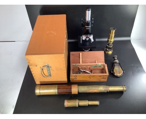 A three drawer brass and rosewood telescope engraved T C Heath Plymouth, complete with end cap and lens slide, 57cm when exte