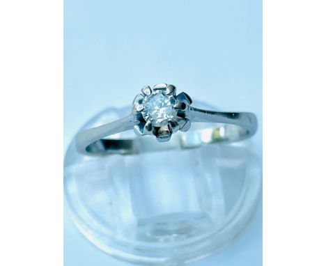 A white gold solitaire diamond ring, set with a round brilliant cut diamond in a six claw setting, estimated weight of diamon
