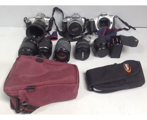 A Canon EOS 400D camera, together with a Canon EOS 300 camera, another EOS 300 body and various lenses including Canon 80-200