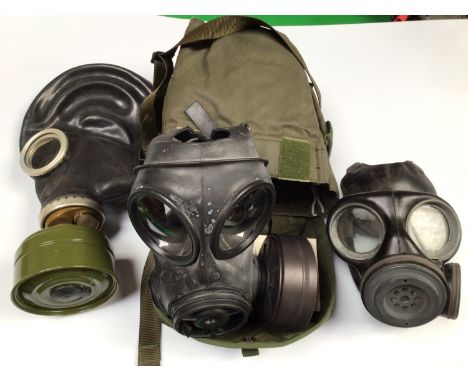 A British Army S10 gas mask in haversack with instructions, together with Soviet GP-5 gas mask and another with Danish mark C