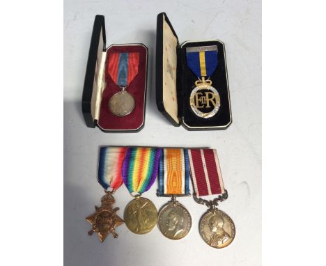 A WW1 medal trio together with a Meritorious Service Medal to H.E Sutton (Victory Medal a replacement) Royal Army Service Cor