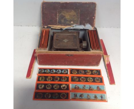 A 19th century boxed GBN tin Plate Magic Lantern, together with various assorted slides 