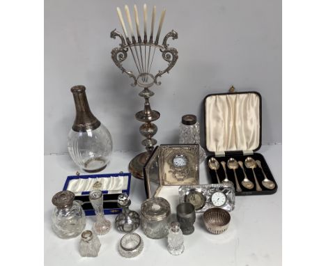 A cased set of six silver teaspoons, together with a single cased silver teaspoon, some silver topped jars and bottles, a sil