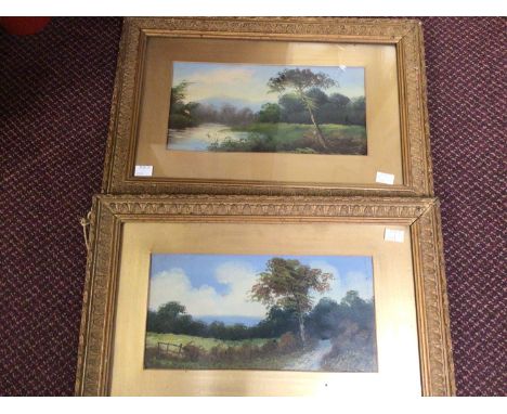 Two country landscape studies with trees by a riverbank and mountainous landscapes beyond, unsigned, oils on board, 18 x 38cm