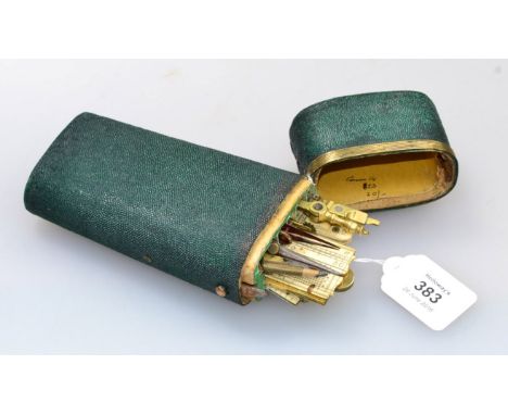 An early 19th century gilt metal mounted shagreen cased technical drawing instrument etui, containing folding rules by Bakewe