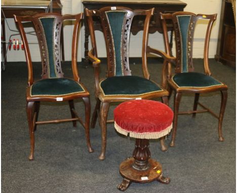 An early Victorian mahogany revolving piano stool, with acanthus column disc sub-base and velvet upholstered top, together wi