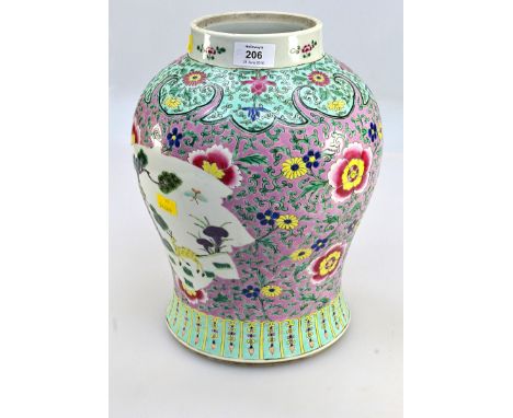 A large 19th century Chinese famille rose baluster vase, painted with flowers and scrolls in colours on a pink enamel ground 