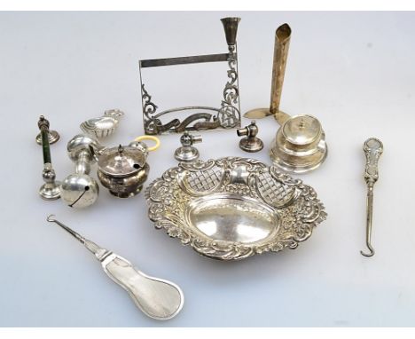 A mixed lot of small silver, including a menu stand with posy holder, rattle, folding button hook, scalloped caddy spoon, ony