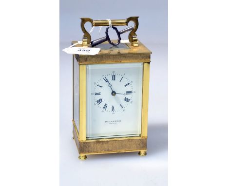 Taylor and Bligh, a Fema brass carriage clock, the eleven jewel eight day movement striking on a bell faced by enamel Roman d