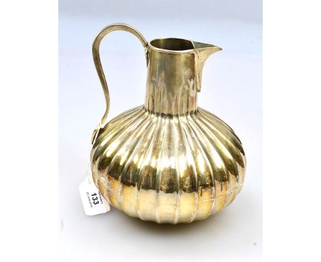 A 20th century possibly American (900 coin silver) water pitcher, of fluted globular form, with pinched spout and arched bow 