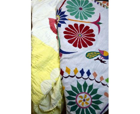 A collection of hand made patchwork quilts, and other textiles
