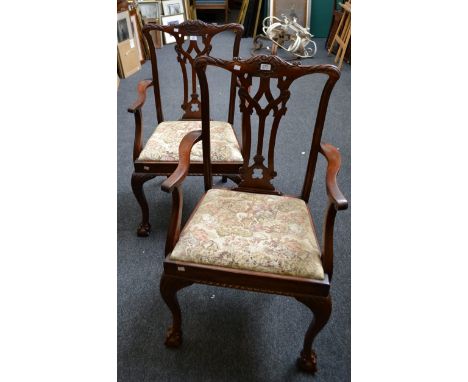 A pair of c1900 mahogany Chippendale style mahogany 'ribbon' back open arm carver chairs, with cabriole support