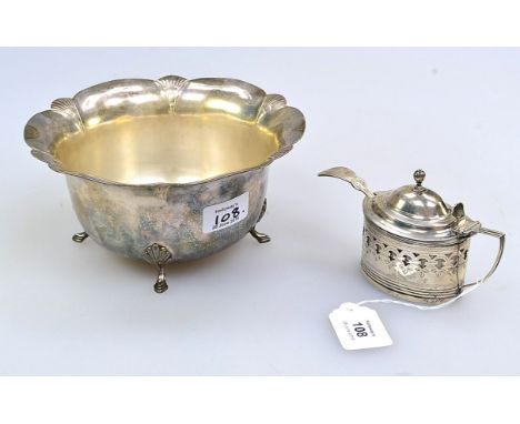 A George III mustard pot, oval with reeded borders and pierced sides, domed hinged cover with knop finial and 'd' shaped reed