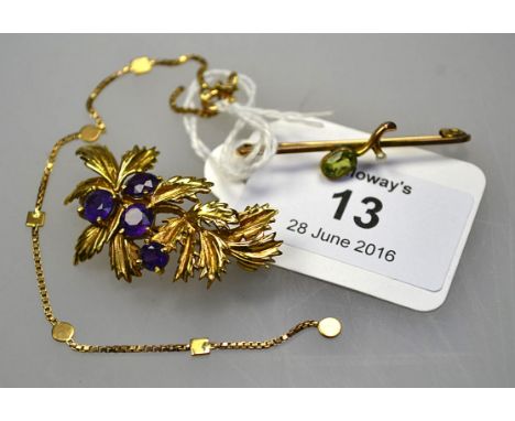 A 9ct gold and amethyst leaf brooch, a peridot and seed pearl bar brooch and a 9ct gold box link bracelet