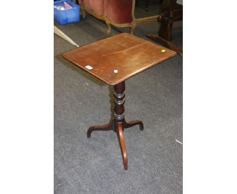 An early 19th century mahogany tripod table, with rectangular moulded top, raised on inverted sabre supports, 52cm wide
