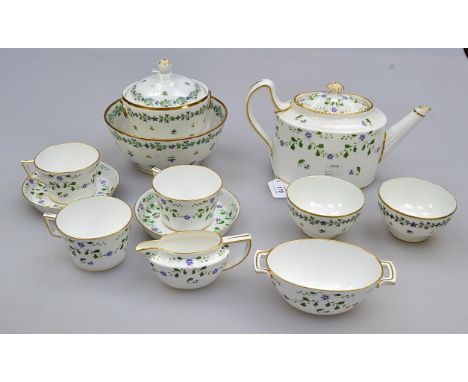 A collection of late 18th/early 19th century Parisian porcelain tea bowls and saucers, decorated in a Chantilly sprig variant