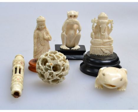 A small collection of 19th and early 20th century Indian and Chinese carved ivory, including Ganest figure, dip pen and puzzl