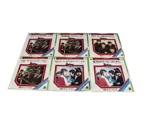 Beatles Japanese 7" Singles, sixteen Japanese singles - all with foldover picture / info sleeves and Green Toshiba or Black A