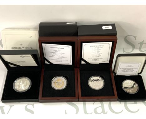 A cased Royal Mint Platinum Wedding anniversary Â£5 silver coin together with 3 commemorative silver cased coins. (A)