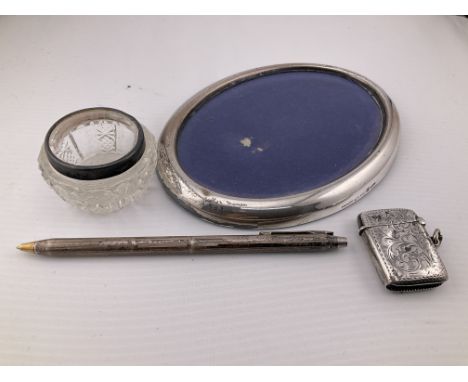A collection of silver items. Postage category A.
