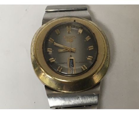 A rare Gents Vintage Seiko 5 wrist watch Automatic 21 Jewel with an oval brass vase and vertical day date serial number 44108