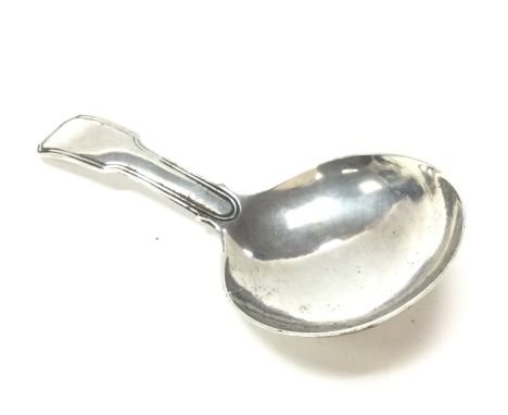 A Georgian silver caddy spoon. Postage category A