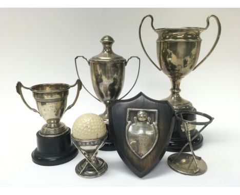 A Collection of silver hallmarked trophies. 5 to 20cm tall approximately. Postage category B