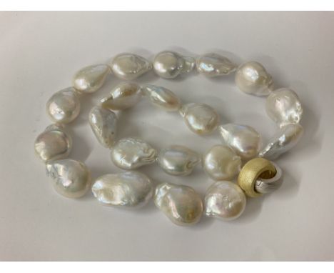 Baroque Pearl necklace with brushed gold plated and silver hooped clap. Postage category A.