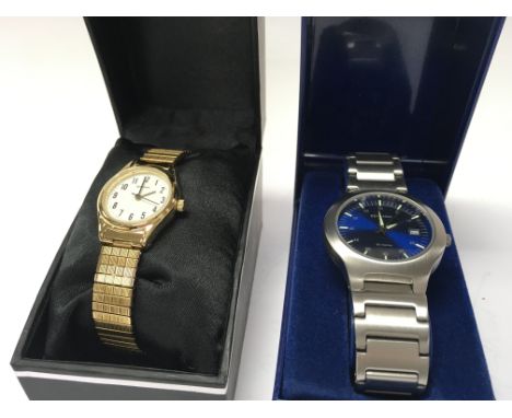 Two boxed Sekonda quartz watches Comprising a mens blue face date watch and a ladies gold tone watch. Postage category B