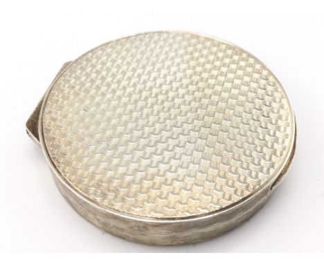 A Silver Asprey circular shaped silver gilt compact, London 1957