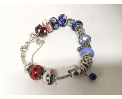 A Links of London silver bracelet with coloured beads.