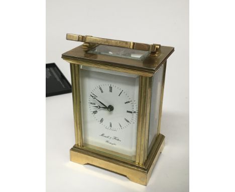 A brass cased carriage clock the rectangular dial maker Mowell & Hilton Huntingdon.