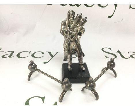 A silver plated judaica figure, approx height 14cm and a pair of silver plated knife rests (3). Shipping category B.