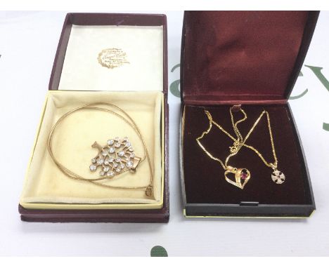A silver gilt 'tree of life' pendant on chain silver gilt heart pendant and one other. Shipping category A.