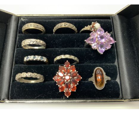 A small collection of silver, silver and stone set rings etc. (10), postage Catagory A.