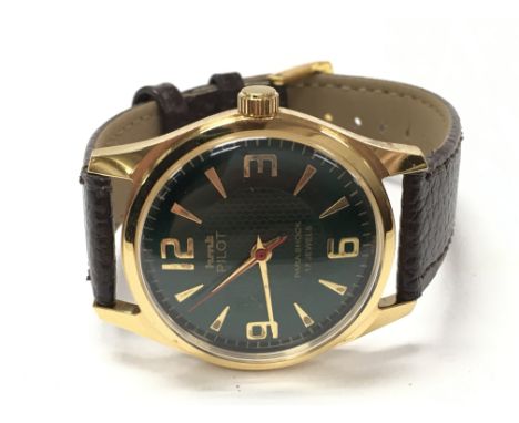 A HMT pilots Manual wind watch, 35mm case. Seen working. Postage category A