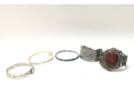 Eastern and silver bangles. Postage category A NO RESERVE