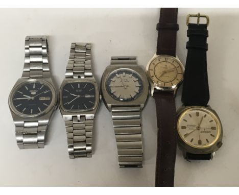 Five Vintage gents pocket watches the Seiko 5 day date Automatic seen working.