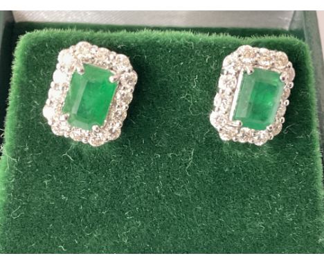 Pair of 18ct white gold rectangular earrings with chamfered corners, set with step cut emeralds and RBC diamonds, boxed. Emer