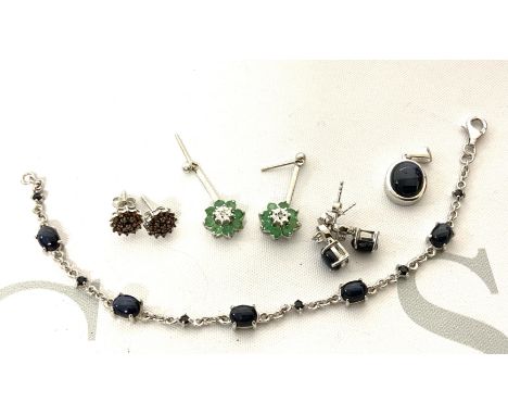 A small collection of silver and stone set jewellery to include a white gold emerald and diamond drop earrings. (A)