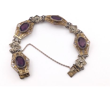 An Edwardian style silver bracelet set with purple stones. Postage A. NO RESERVE