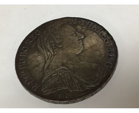 A silver Austrian 1780 Theresa Maria SF coin.