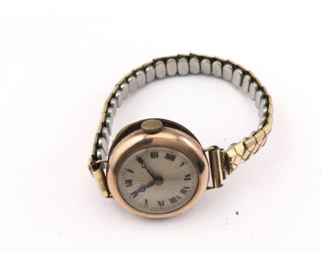 A 9ct gold cased vintage wrist watch. Postage A