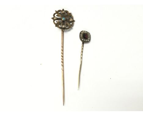 Two stick pins in a fitted case set with seed pearls. Postage A