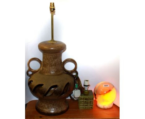 A 1970's polished onyx table lamp together with a Poole pottery table lamp and a German pottery table lamp, German pottery ta