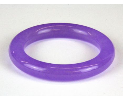 A lavendar jade bangle, Dia. 1.1cm Internal Dia. 6.1cm.