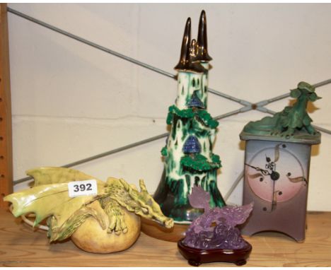 A ceramic table lamp, clock and two other dragon items.